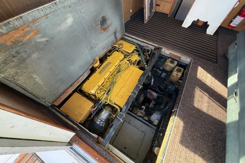 Slide: The Image of Engine compartment of a 1971 Bertram 35 Sport Fisherman boat, showcasing mechanical components. - 40