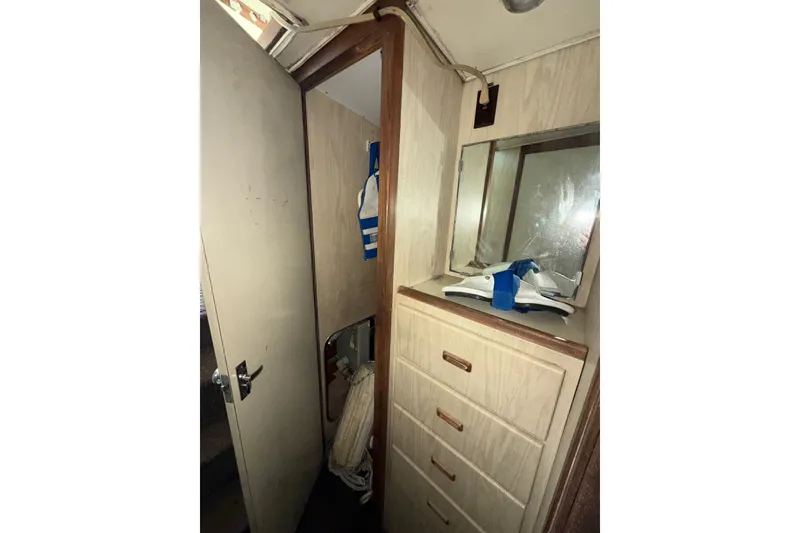Slide: The Image of Interior of 1971 Bertram 35 Sport Fisherman with wooden cabinetry and mirror. - 30