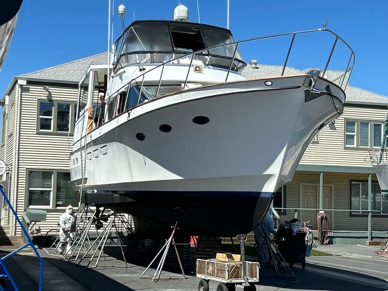 Slide: The Image of A 1988 Ocean Alexander 546 Cockpit Motoryacht is propped up for maintenance. - 29