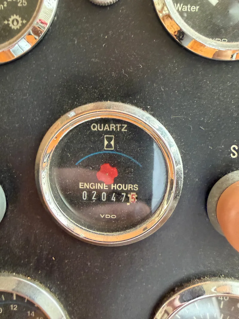Slide: The Image of Close-up of an engine hour meter showing 2047.5 hours on a yacht. - 25