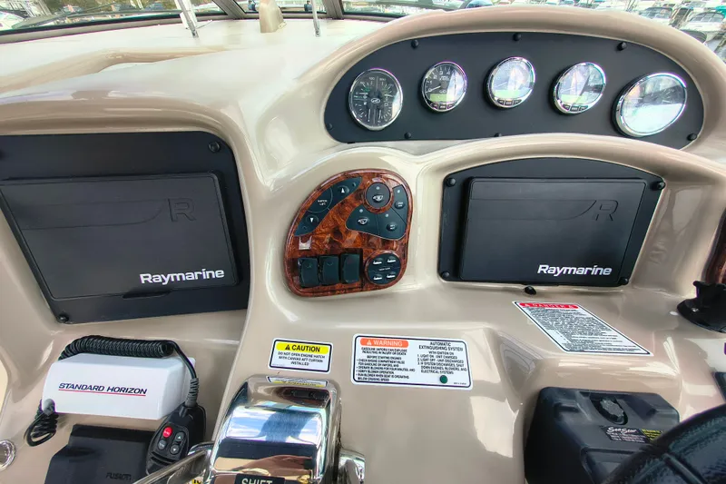 Slide: The Image of Dashboard of a 2006 Sea Ray 340 Sundancer with Raymarine navigation equipment. - 15