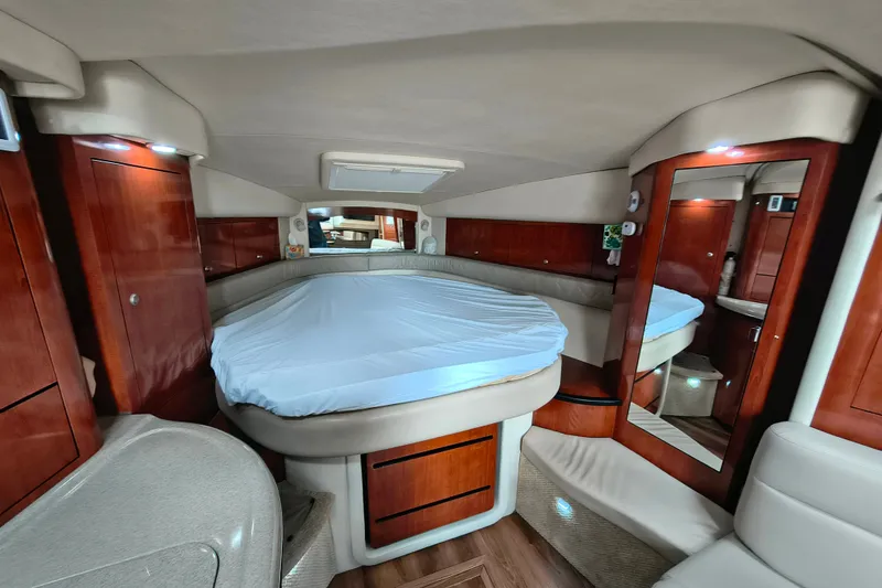 Slide: The Image of Luxurious interior of a 2006 Sea Ray 340 Sundancer yacht cabin with wood finishes. - 20
