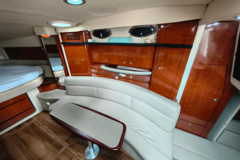 Slide: The Image of Luxurious interior of 2006 Sea Ray 340 Sundancer with elegant wood cabinetry and seating. - 18