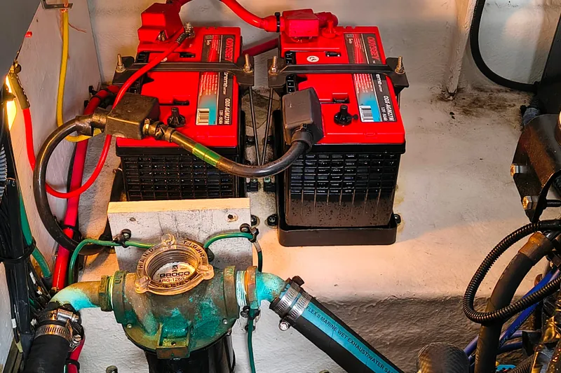 Slide: The Image of Engine compartment of a 2006 Sea Ray 340 Sundancer with batteries and wiring. - 27