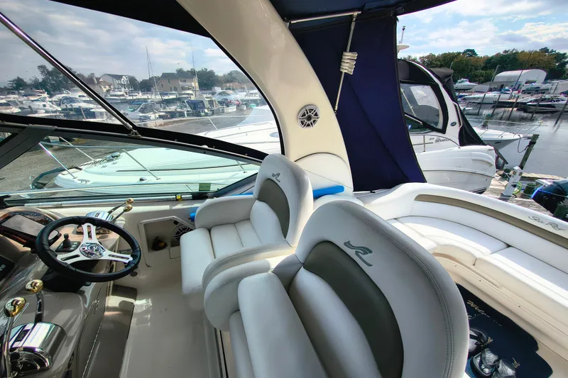 Slide: The Image of Interior of a 2006 Sea Ray 340 Sundancer yacht at a marina. - 11