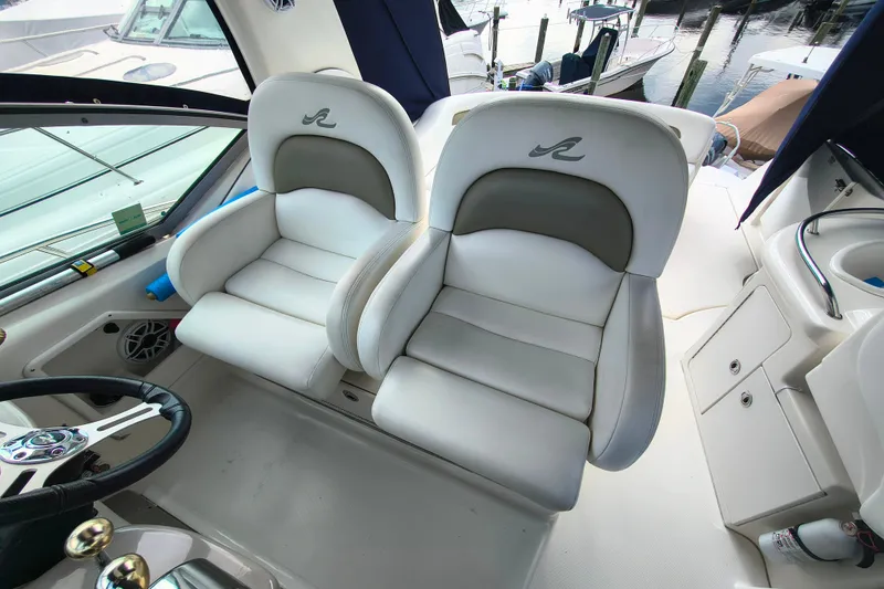 Slide: The Image of Luxury seating on a 2006 Sea Ray 340 Sundancer yacht, featuring plush white upholstery. - 12