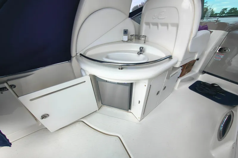 Slide: The Image of 2006 Sea Ray 340 Sundancer boat interior with sink and storage cabinets. - 8