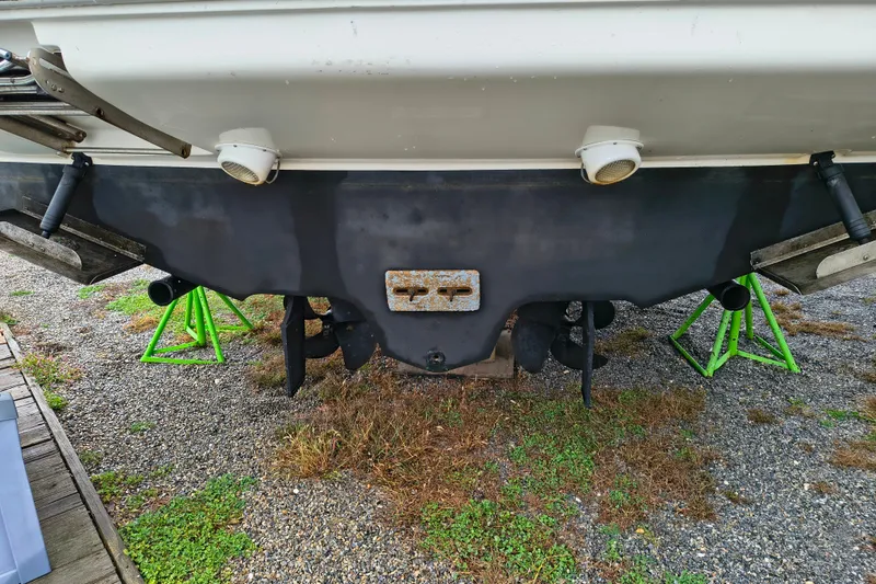 Slide: The Image of Rear view of a 2006 Sea Ray 340 Sundancer boat on stands. - 2