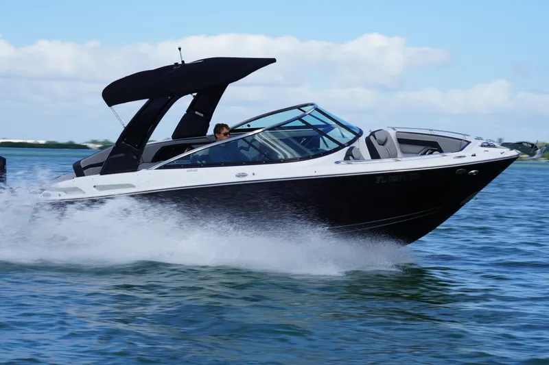 Slide: The Image of 2026 Monterey 255SS Super Sport boat cruising on open water. - 8