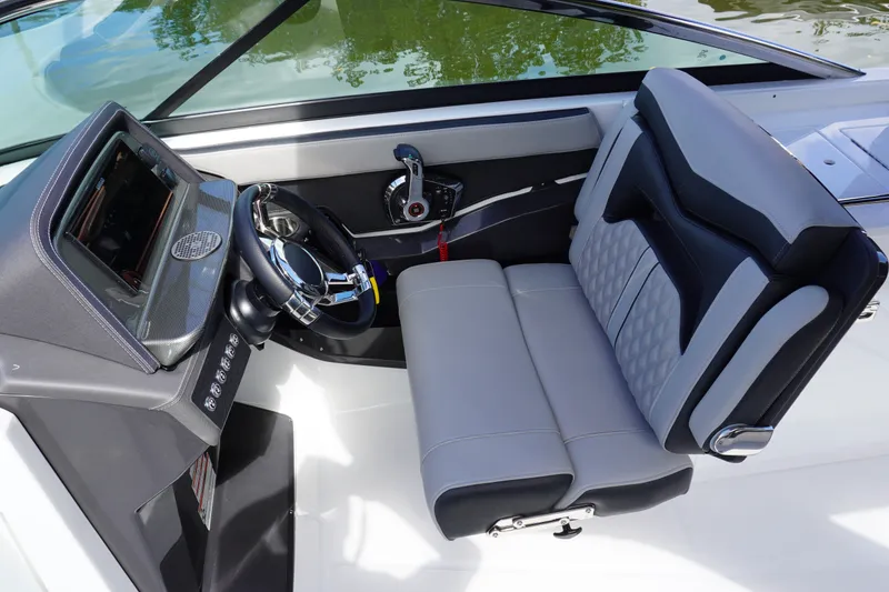 Slide: The Image of 2026 Monterey 255SS Super Sport boat cockpit with modern steering and seating. - 25