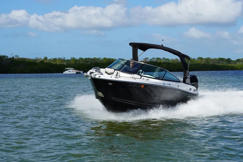 Slide: The Image of 2026 Monterey 255SS Super Sport boat cruising on a sunny day. - 7