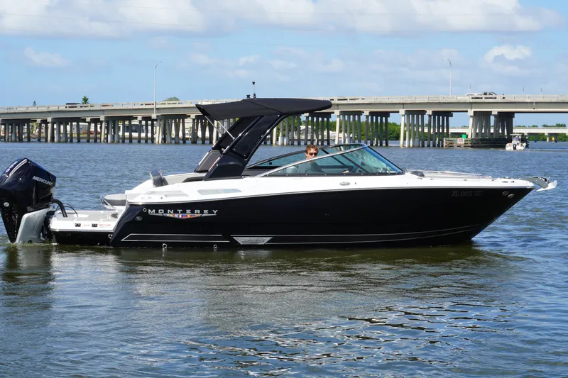 The Image of 2026 Monterey 255SS Super Sport boat on water near a bridge, under a clear sky. - 0