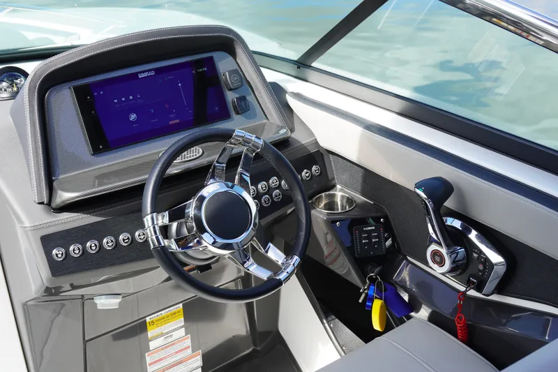 Slide: The Image of Cockpit of 2026 Monterey 255SS Super Sport boat with modern steering and controls. - 24