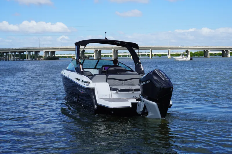 Slide: The Image of 2026 Monterey 255SS Super Sport boat on water near a bridge under blue sky. - 5