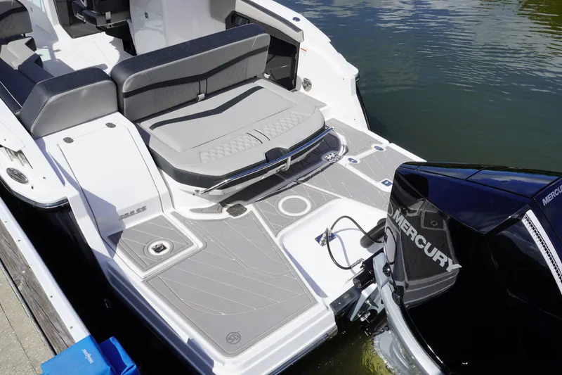 Slide: The Image of 2026 Monterey 255SS Super Sport boat with Mercury engine, featuring sleek seating and modern design. - 11