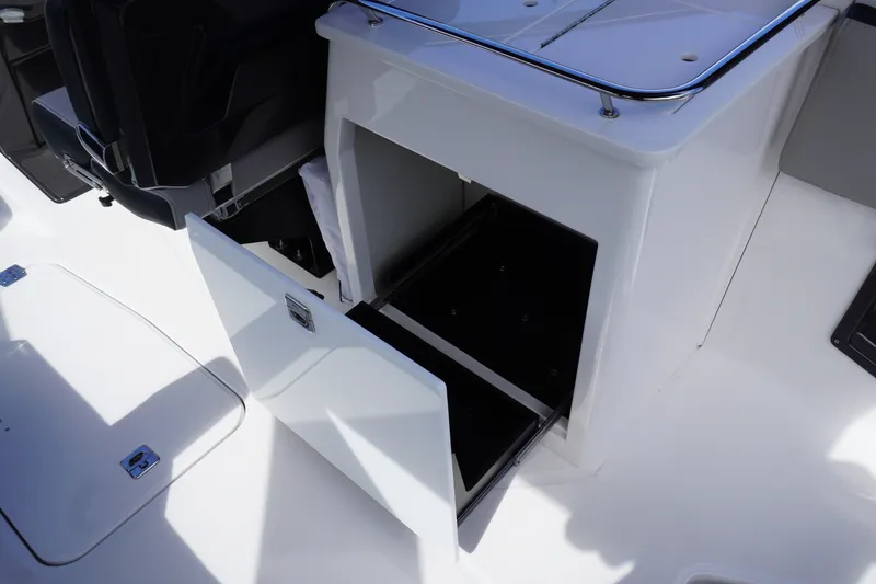 Slide: The Image of 2026 Monterey 255SS Super Sport boat interior storage compartment open. - 22