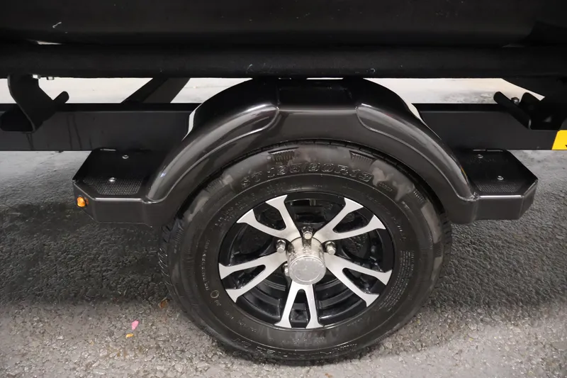Slide: The Image of 2023 Sea-Doo Switch Sport Compact trailer wheel with black fender and alloy rim. - 40