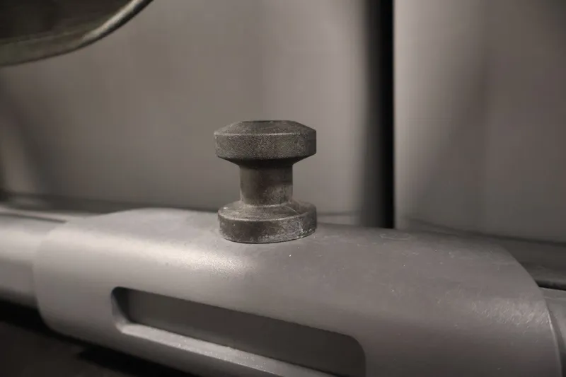 Slide: The Image of Close-up of a 2023 Sea-Doo Switch Sport Compact component, featuring a black knob on a gray surface. - 35
