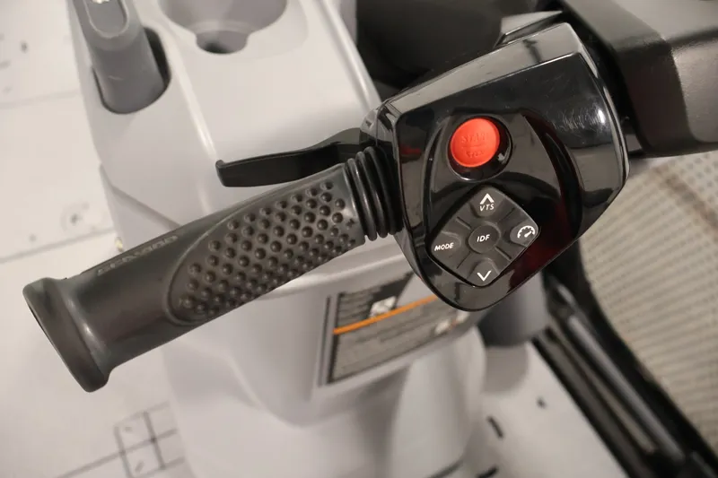 Slide: The Image of Close-up of 2023 Sea-Doo Switch Sport Compact handlebar controls with buttons and grip. - 16