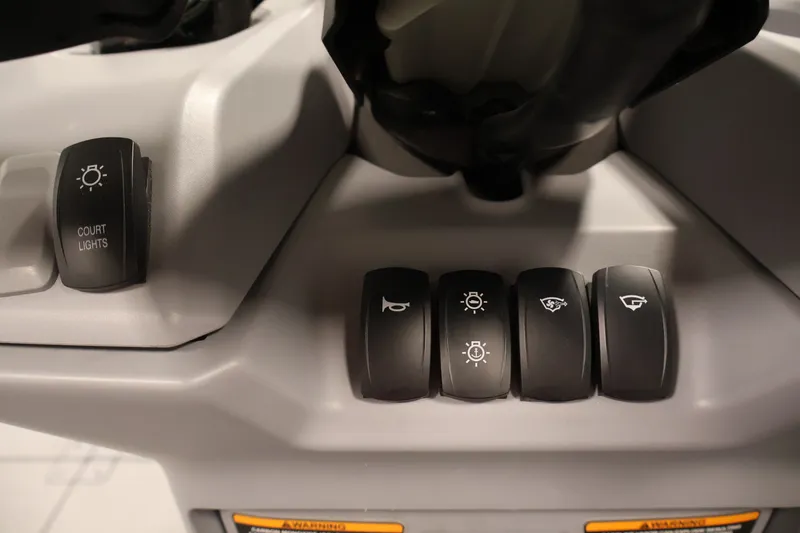 Slide: The Image of Control panel of 2023 Sea-Doo Switch Sport Compact with various switches and buttons. - 20