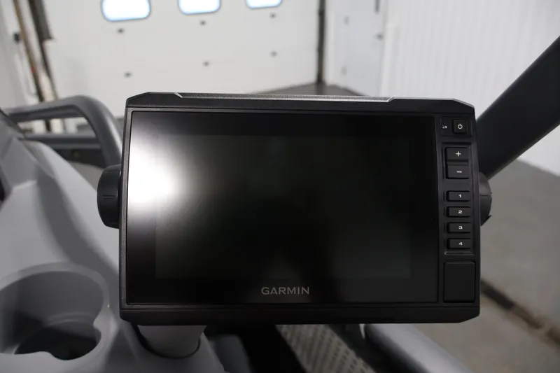 Slide: The Image of Garmin display on 2023 Sea-Doo Switch Sport Compact dashboard in a garage setting. - 19