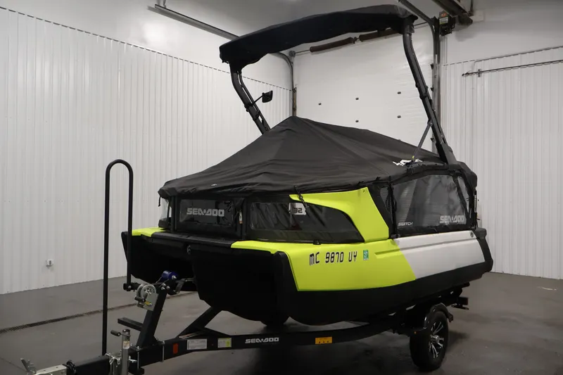 Slide: The Image of 2023 Sea-Doo Switch Sport Compact in a garage, covered and on a trailer. - 42