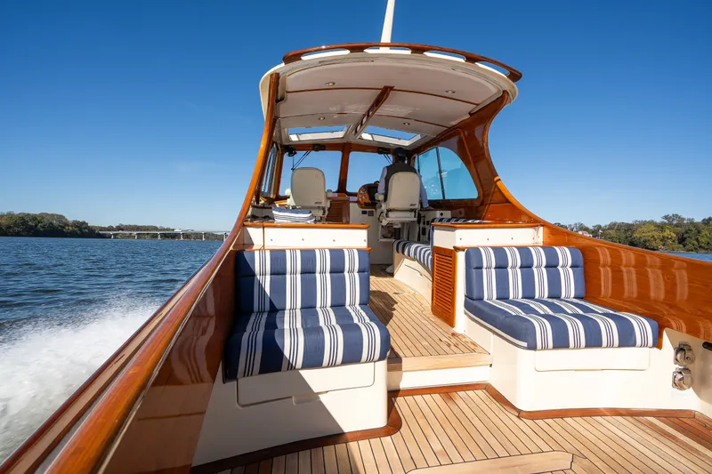 Slide: The Image of 2017 Hinckley Picnic Boat 37 MKIII cruising on a sunny day with striped seating. - 12