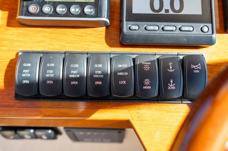 Slide: The Image of Control panel of a 2017 Hinckley Picnic Boat 37 MKIII with various switches and buttons. - 29