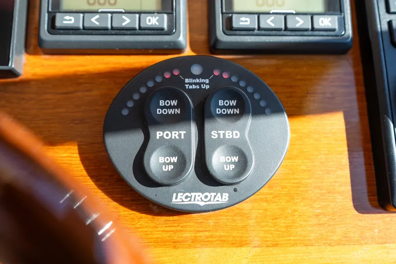 Slide: The Image of Control panel of a 2017 Hinckley Picnic Boat 37 MKIII with Lectrotab trim tab switches. - 28