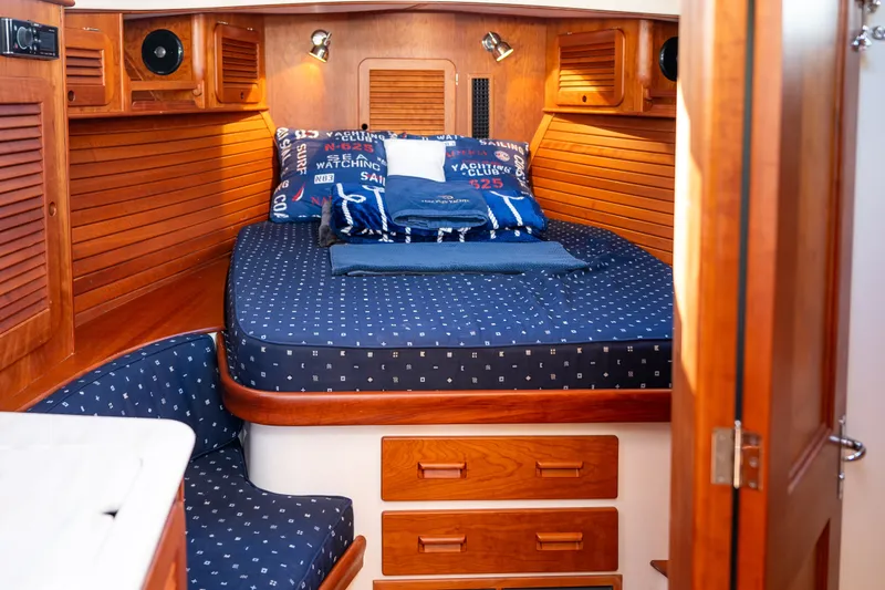 Slide: The Image of Cozy cabin interior of 2017 Hinckley Picnic Boat 37 MKIII with nautical-themed bedding. - 36
