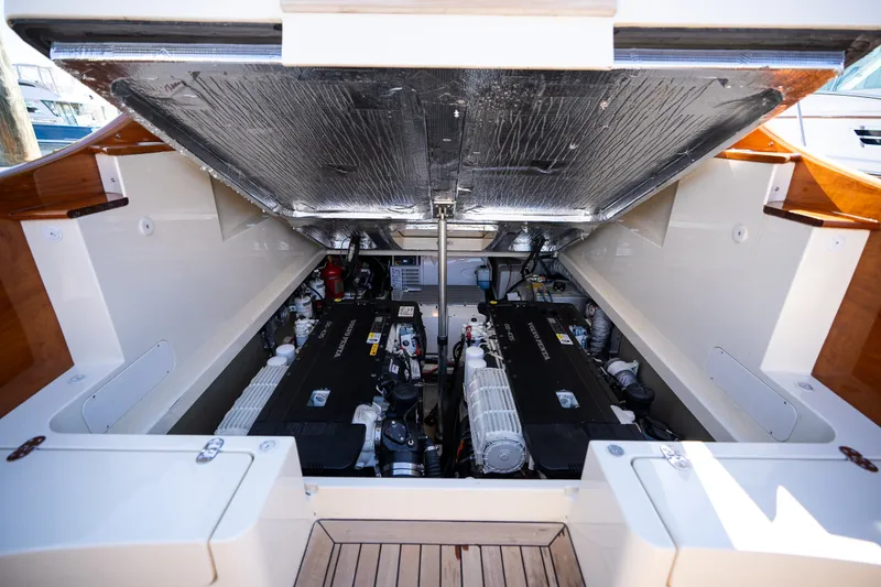 Slide: The Image of Engine compartment of 2017 Hinckley Picnic Boat 37 MKIII, showcasing dual engines. - 44