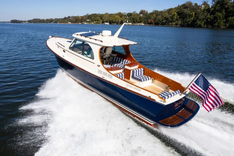 Slide: The Image of 2017 Hinckley Picnic Boat 37 MKIII cruising on a scenic lake. - 4