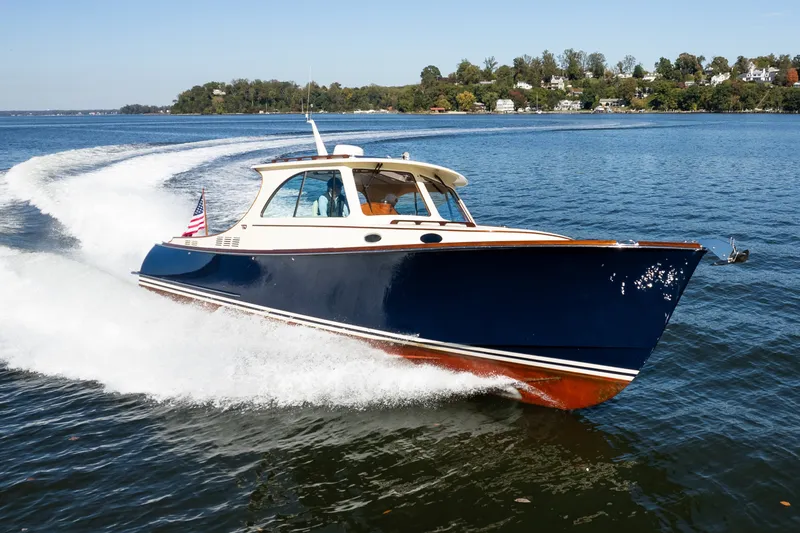 Slide: The Image of 2017 Hinckley Picnic Boat 37 MKIII cruising on a sunny day, displaying sleek design. - 3
