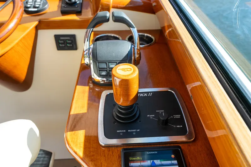 Slide: The Image of Helm controls of 2017 Hinckley Picnic Boat 37 MKIII with joystick and navigation display. - 27