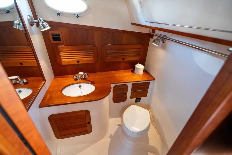 Slide: The Image of Luxurious bathroom interior of 2017 Hinckley Picnic Boat 37 MKIII with wooden accents. - 41