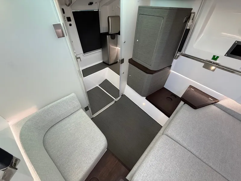 Slide: The Image of Interior of the 2024 Axopar 37 XC Cross Cabin with gray upholstery and modern design. - 21