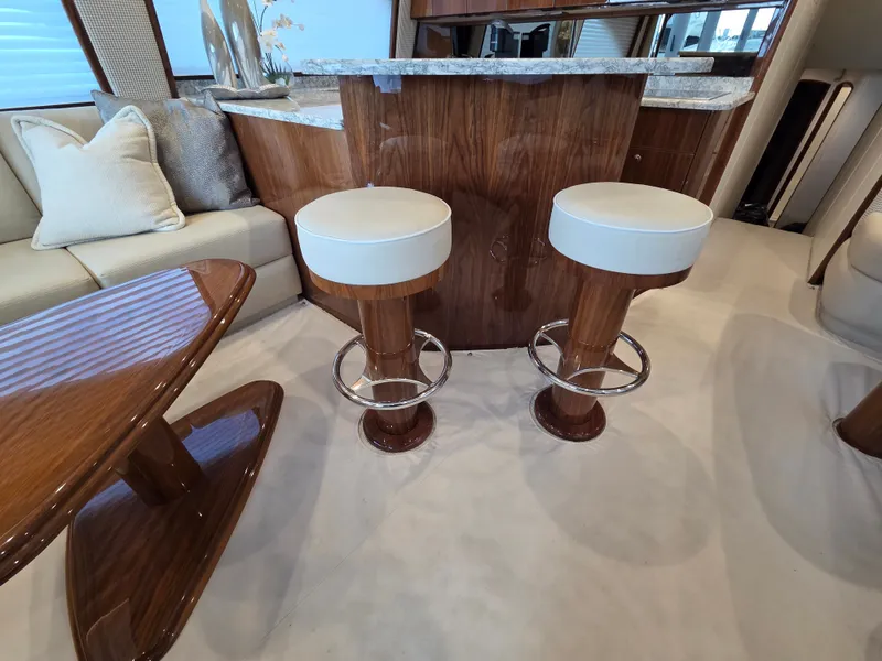 Slide: The Image of Interior of the 2023 Viking Convertible with elegant wood furnishings and modern bar stools. - 15