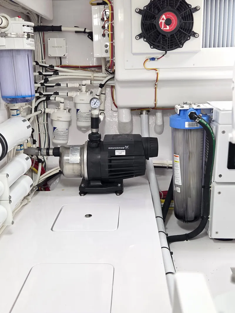 Slide: The Image of Engine room of the 2023 Viking Convertible with pumps and filters. - 31