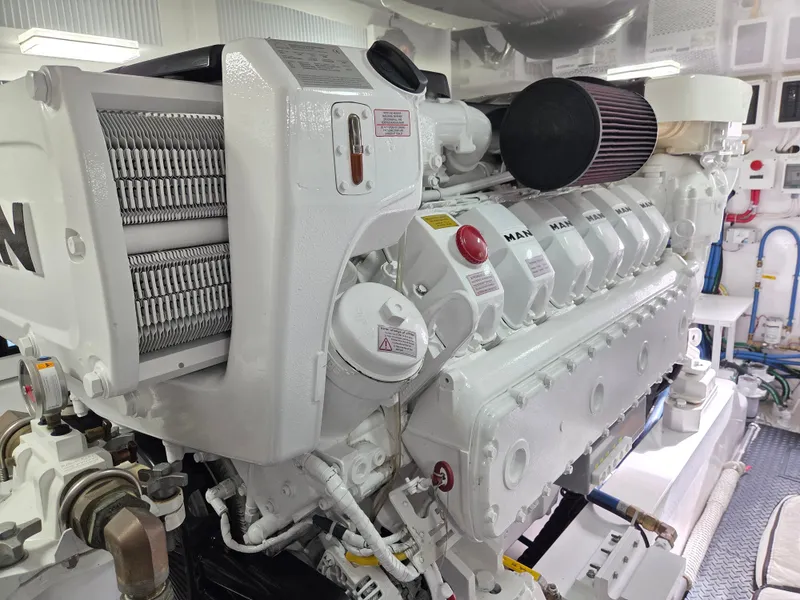 Slide: The Image of Engine room of a 2023 Viking Convertible with a clean, white engine and technical details. - 28