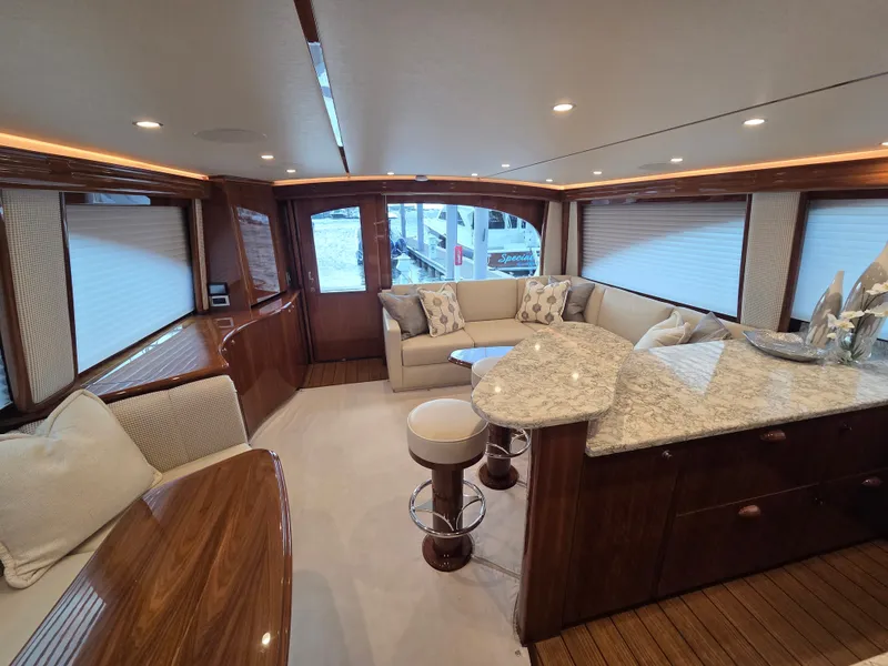 Slide: The Image of Interior of a luxury yacht with elegant wood furnishings and a cozy seating area. - 16