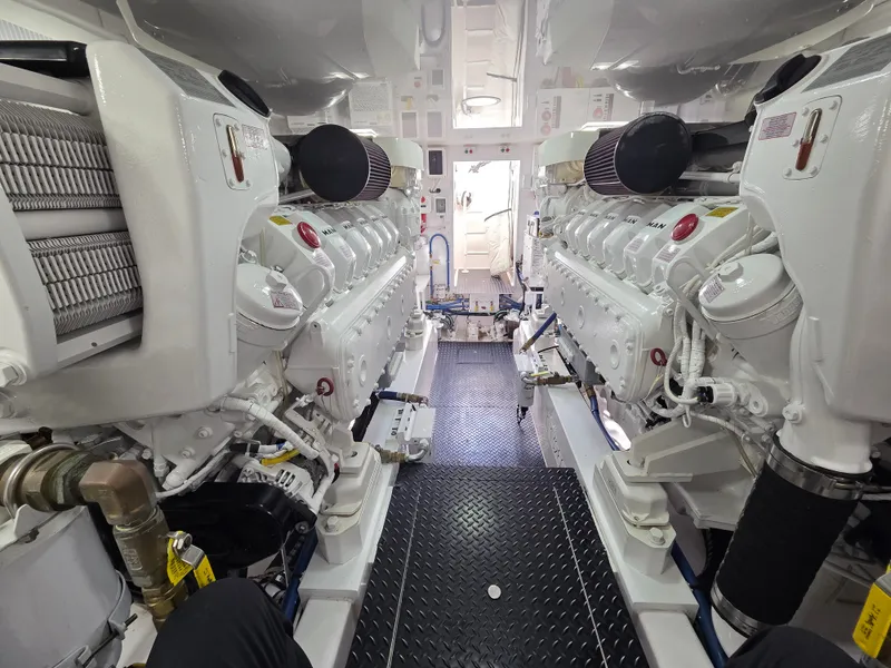 Slide: The Image of The engine room of a 2023 Viking Convertible with two large white engines. - 27