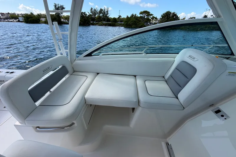 Slide: The Image of 2014 Boston Whaler 315 Conquest interior seating with water view. - 41