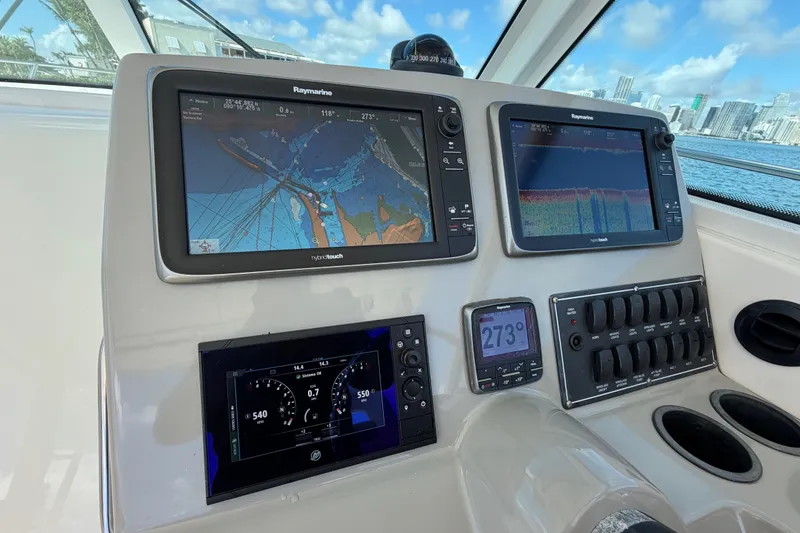 Slide: The Image of Control panel of a 2014 Boston Whaler 315 Conquest with navigation displays. - 33
