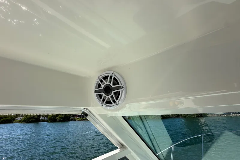 Slide: The Image of Speaker on 2014 Boston Whaler 315 Conquest boat, overlooking water. - 39