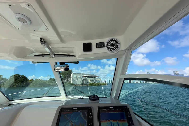 Slide: The Image of Interior view of 2014 Boston Whaler 315 Conquest boat with navigation system. - 36