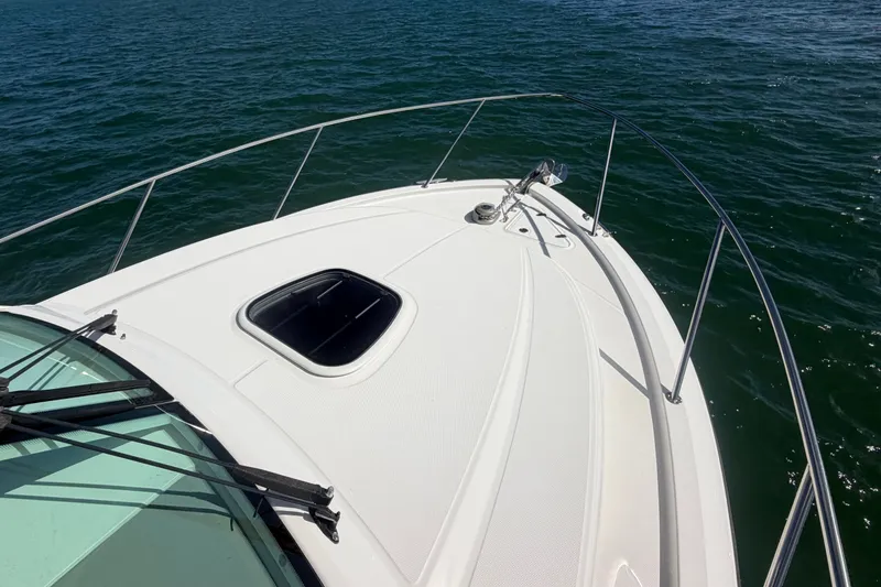 Slide: The Image of 2014 Boston Whaler 315 Conquest boat deck on open water. - 57