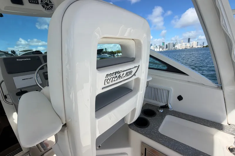 Slide: The Image of 2014 Boston Whaler 315 Conquest interior with city skyline view. - 20