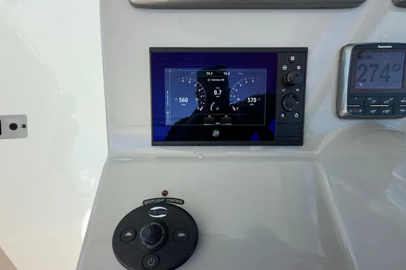 Slide: The Image of Control panel of a 2014 Boston Whaler 315 Conquest boat with digital displays. - 35