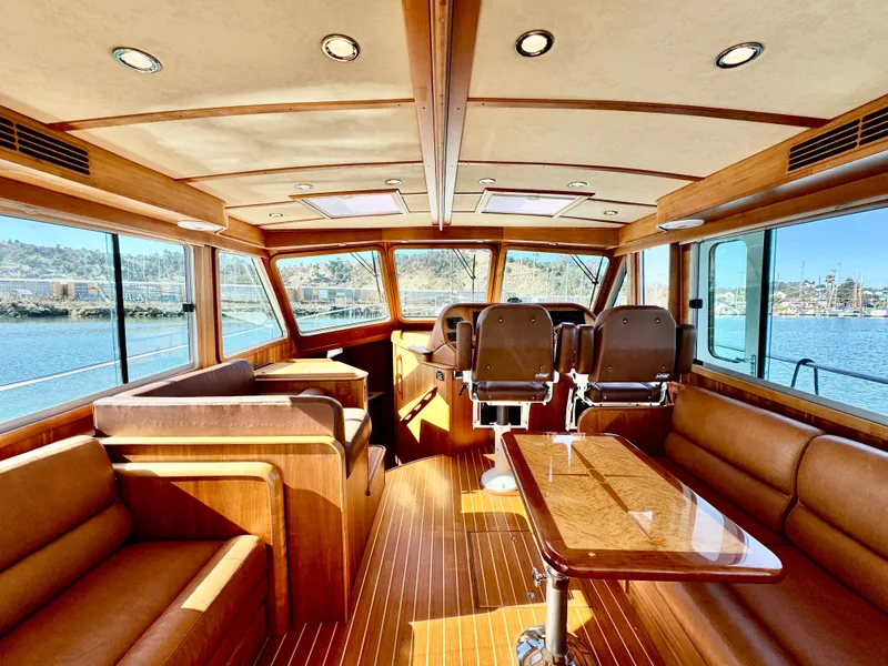 Slide: The Image of Interior of the 2016 Sabre 48 Salon Express with elegant wood accents and panoramic windows. - 16