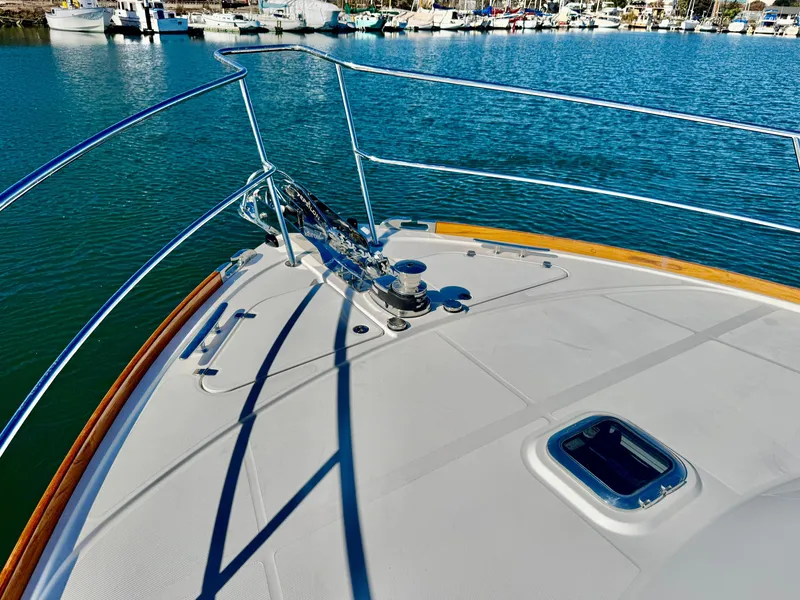 Slide: The Image of Bow view of the 2016 Sabre 48 Salon Express with stainless steel railings and anchor windlass. - 45